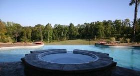 Negative-edge-pool-and-spa-water-bowl-free-form-sheer-decent-stamped-concrete-boarder