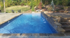 St.-Charles-County-two-tiered-deck-rectangle-pool-stacked-stone-raised-wall-stone-coping