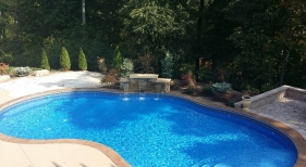 Sunken-sitting-area-tanning-shelf-wedding-cake-steps-stamped-concrete-coping-cool-deck