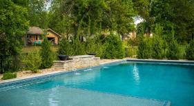 Geometric-gunite-pool-with-raised-wall-and-tanning-ledge